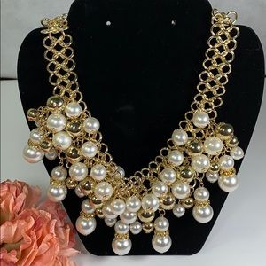 Gold stimulated pearl necklace